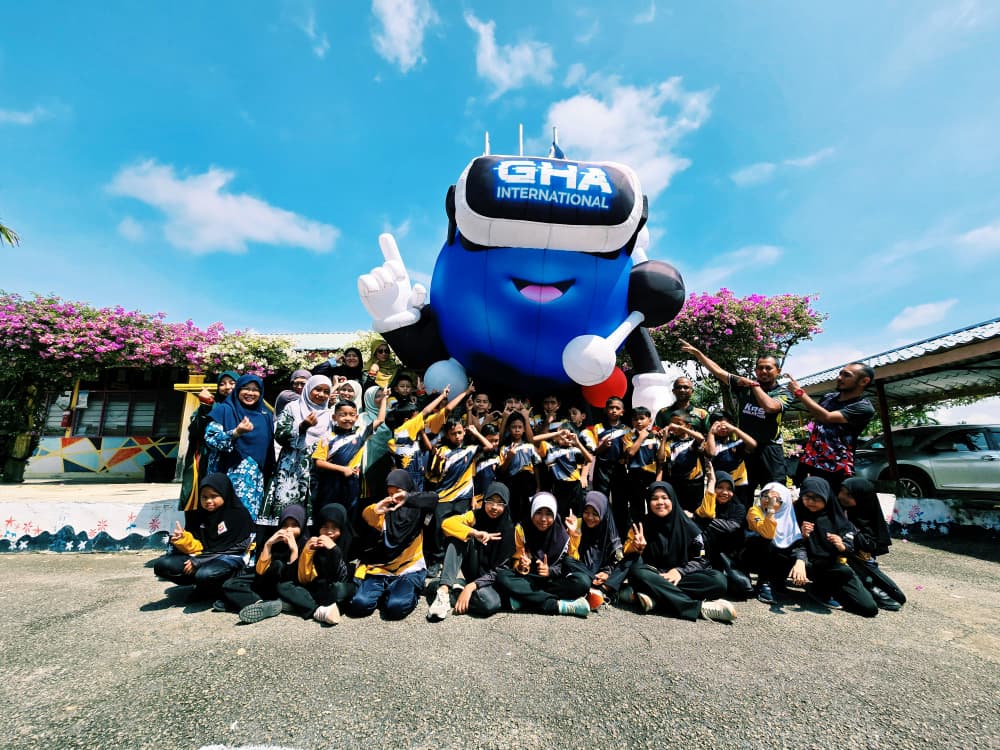 Students and the GHA mascot at a Malaysian school