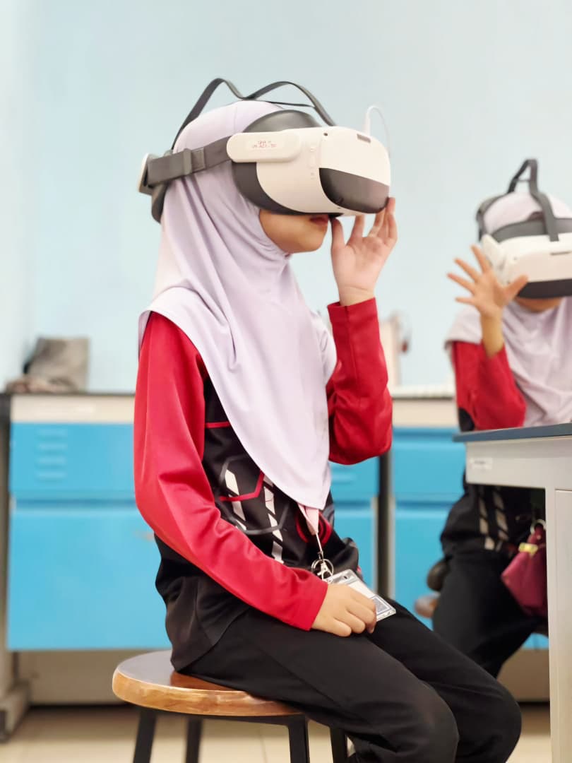 A student wearing a VR headset in a science lab