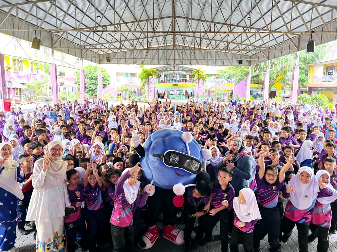 Hundreds of students gathered with the GHA mascot at a school assembly