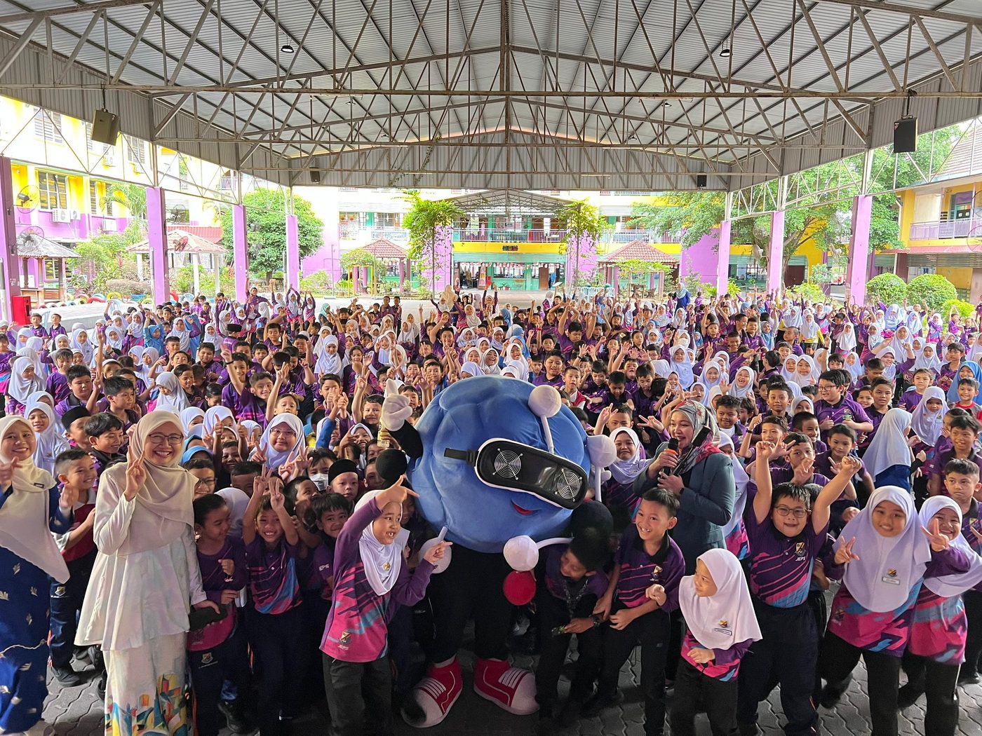 The GHA mascot with students at a government school VR rollout